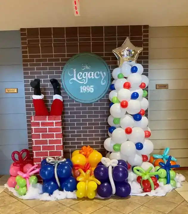 Balloon chimney and white balloon Christmas tree with wrapped balloon presents