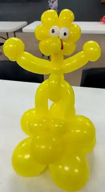 Yellow twisted balloon figure
