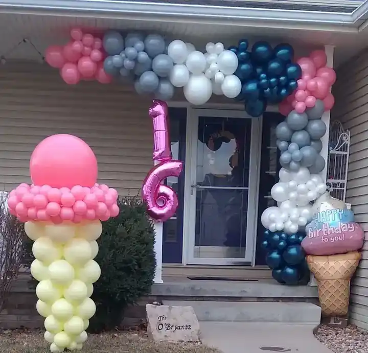 Balloon ice cream cones and a 16 around a front door garland